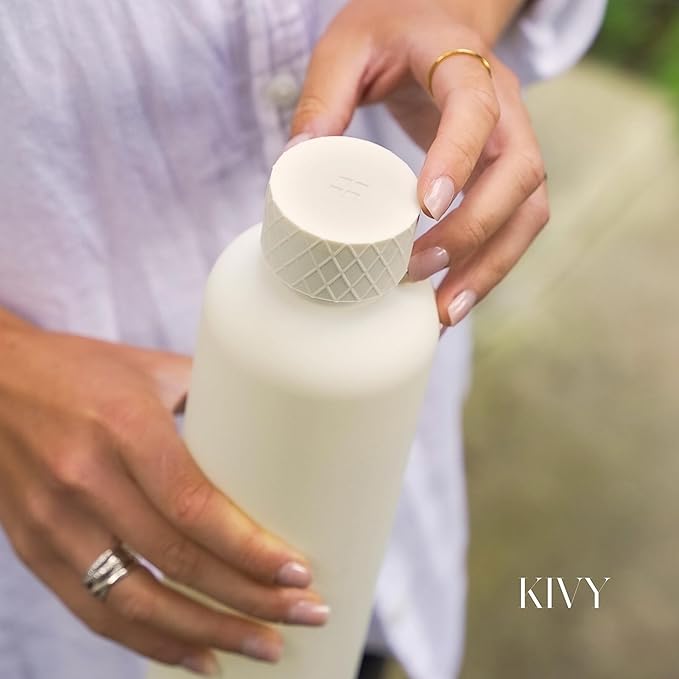KIVY Slim Water Bottle 32oz [Lightweight & Shatterproof] Fits Backpack & Cupholder for Travel, Sports, School, Gym - Clear water bottle with measurements - Transparent Tritan Beige - Dishwasher Safe